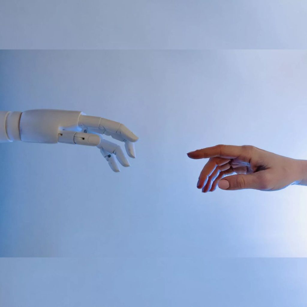 Two hands coming together